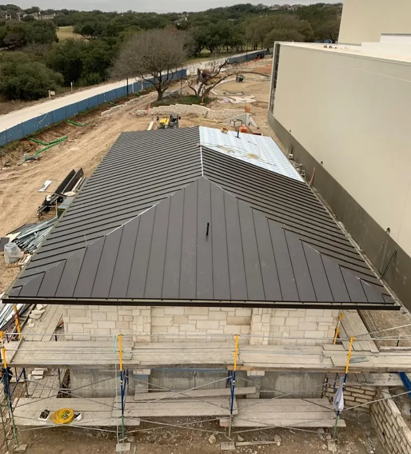 Metal roof new construction with scaffolding in Naples
